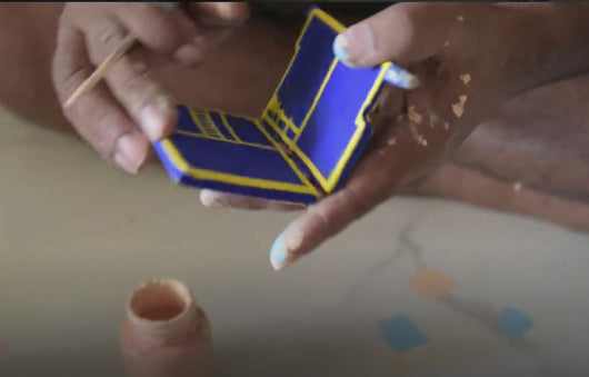 Satyanarayanji painting the forms on Kavad